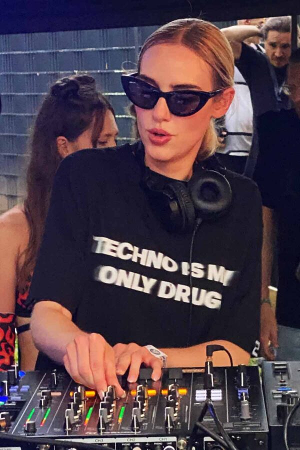 DJ wearing the organic cotton, fair wear black techno is my only drug t-shirt with bold backprint from counting memories techno collection