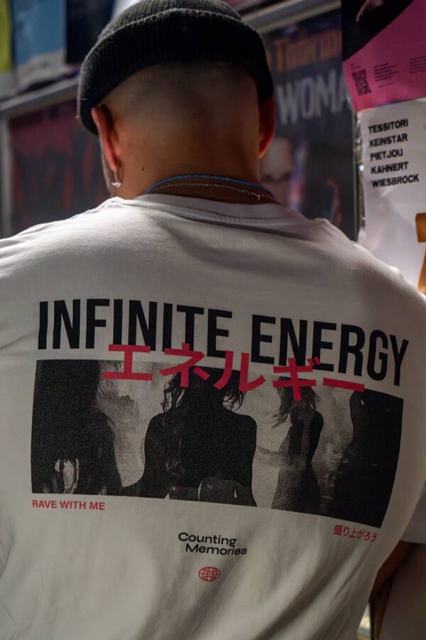 backprint of the organic cotton, fairwear Rave Memories Infinite Energy T-Shirt, worn by DJ collective Parakeet in Cologne