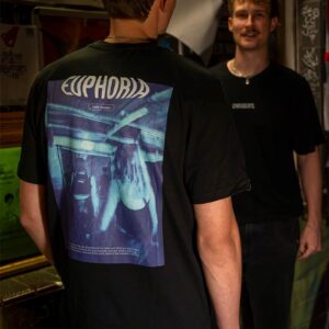 bold backprint of the organic cotton, fairwear Rave Memories Euphoria T-Shirt, worn by DJ collective Parakeet in Cologne